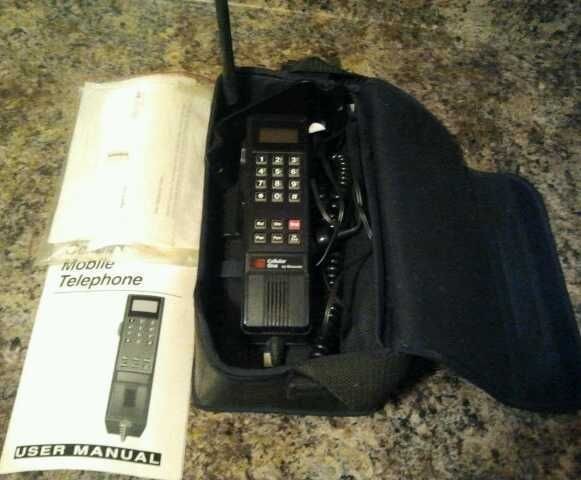 Vintage motorola mobile phone with bag and original manual