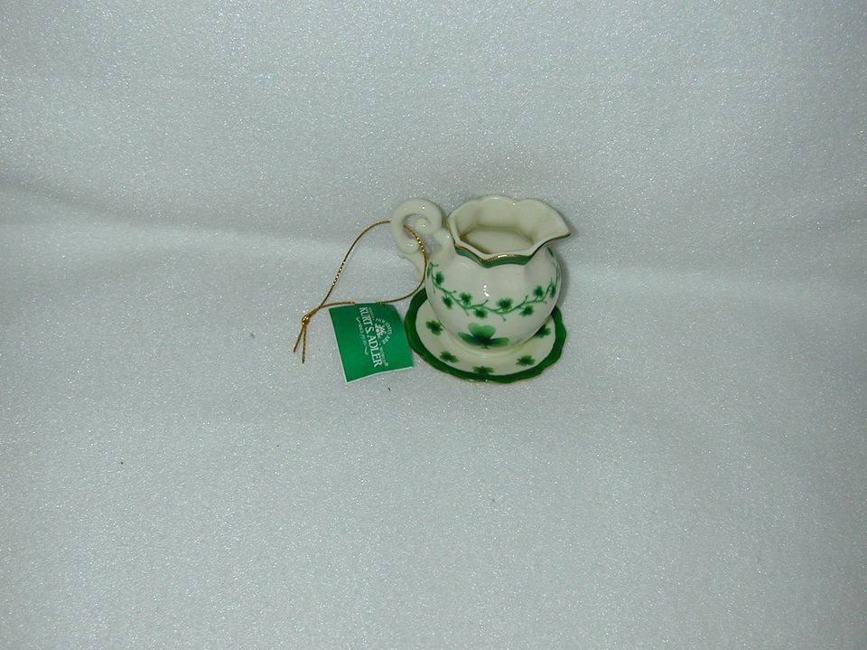 CHRISTMAS IRISH TEAPOT/SAUCER W/GOLD/GREEN TRIM AT TOP/EDGE OF SAUCER 