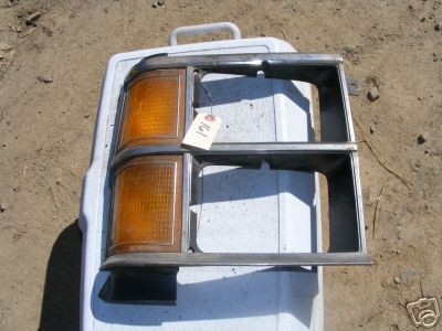 1985 PLYMOUTH VAN PASSENGER SIDE HEADLIGHT BEZEL (12B)