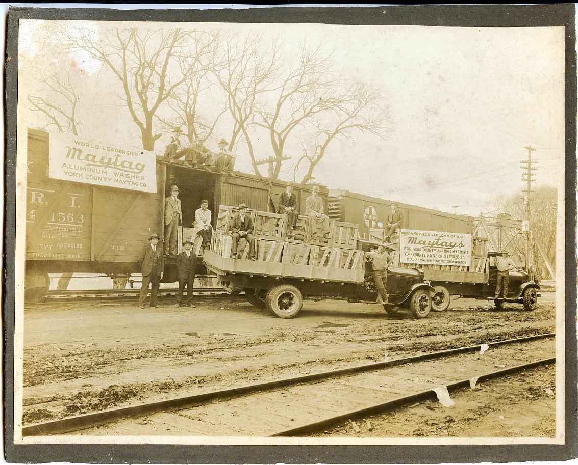 1929 photo on trimmed mount of a train delivery of Another Carload of 