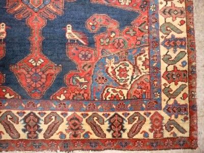 This is a colorful antique Persian trial area rug with pole medallion 