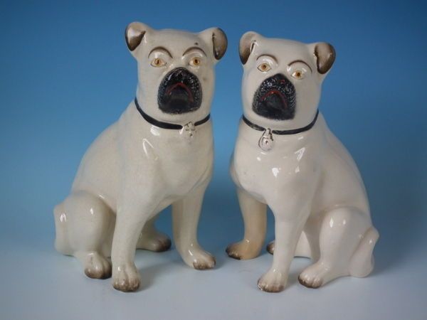 pair staffordshire leg free pugs  950 00