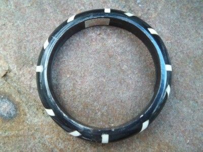 bangle bracelet of ebony and ivory coloured bone