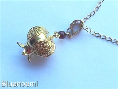 Sterling silver gold plated pomegranate necklace with a garnet