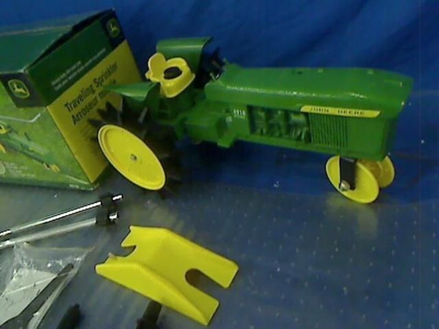 John Deere 4010J Traveling Sprinkler Green