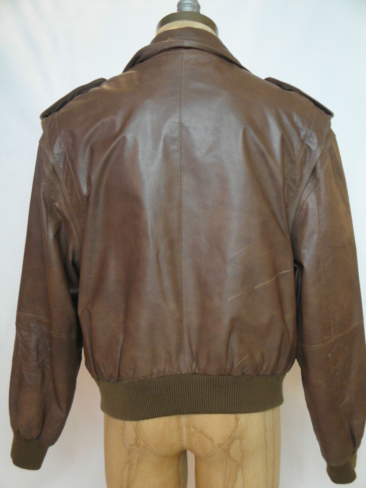 Vintage Members Only leather jacket with zipper front and snap closure