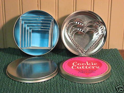Collection of 11 Metal Cookie Cutters in Storage Tins