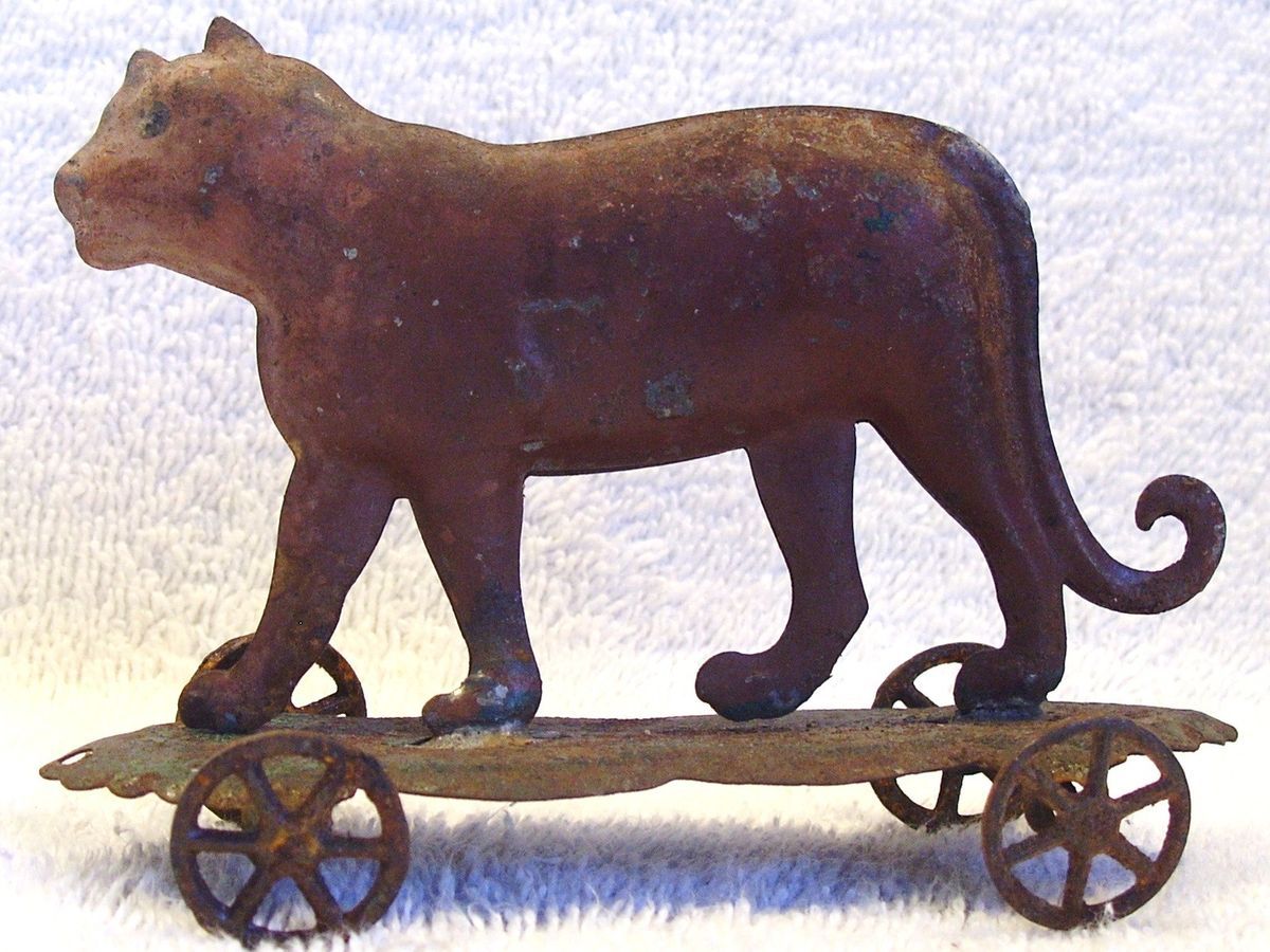 ANTIQUE GERMAN VICTORIAN TIN TIGER PENNY PULL TOY ON PLATFORM W WHEELS